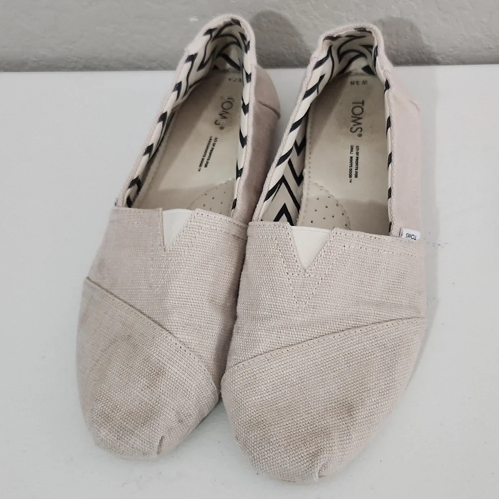TOMS Shoes Size 9.5 Cream Canvas Slip-On has spots flaws